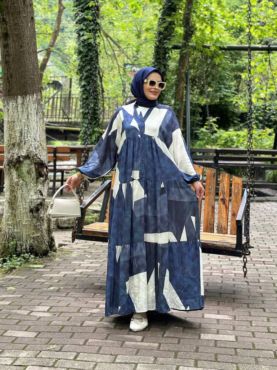 Maxi dress with a blue and white abstract geometric pattern