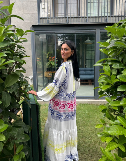White dress with colorful, intricate patterns