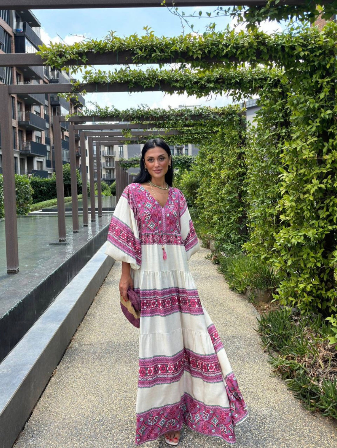 Vibrant purple dress with geometric and floral patterns