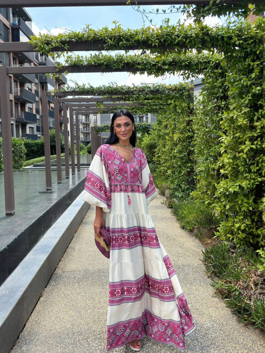 Vibrant purple dress with geometric and floral patterns