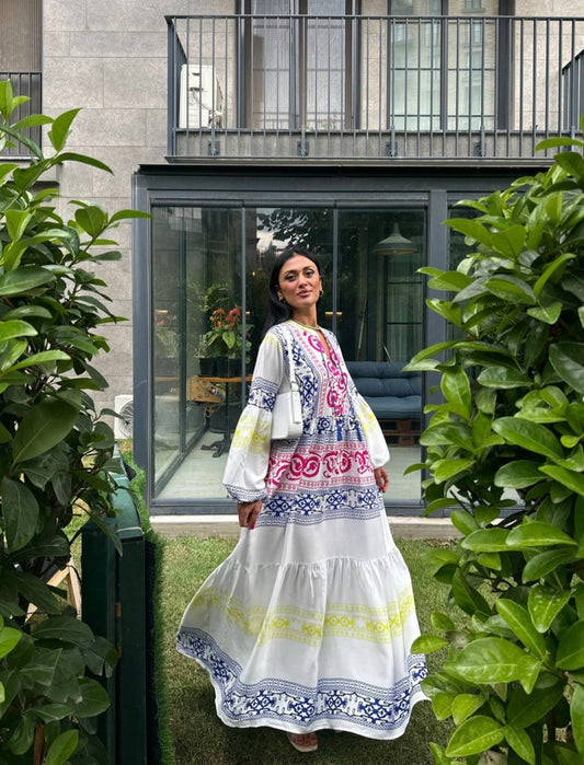 White dress with colorful, intricate patterns